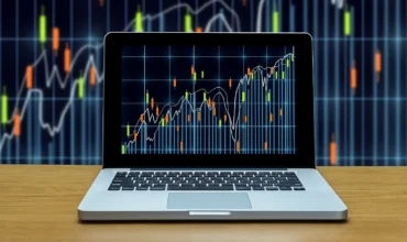 Forex trading software on laptop screen chart